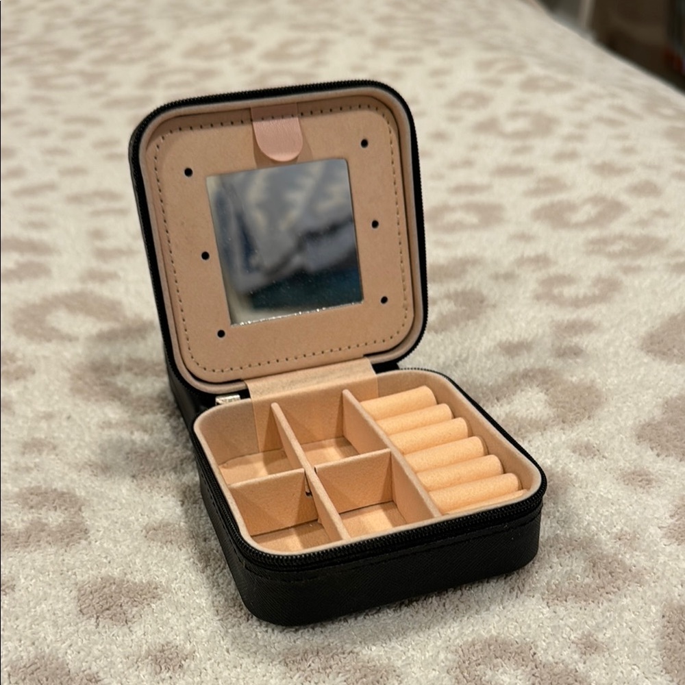 Compact Black Travel Jewelry Case with Beige Interior